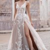 strikingly romantic A-line gown lacy appliqués over a tulle train