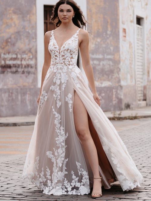 strikingly romantic A-line gown lacy appliqués over a tulle train