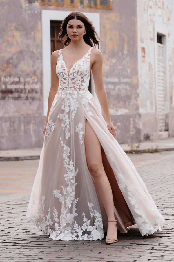 strikingly romantic A-line gown lacy appliqués over a tulle train