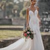 9953 Allure Bridals a Swiss dot pattern, pairs beautifully with the richly beaded and appliquéd strapless bodice of this fit and flare sheath