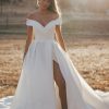 R3602 Allure Romance Crisp, architectural organza softly pleats and tucks along the waist and bodice of this romantic off shoulder gown