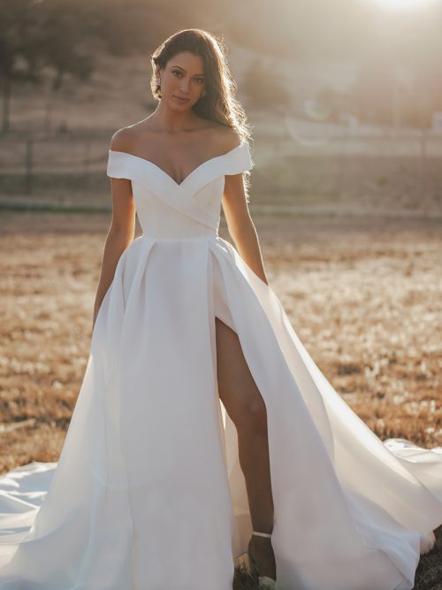 R3602 Allure Romance Crisp, architectural organza softly pleats and tucks along the waist and bodice of this romantic off shoulder gown