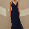 TO2493 Tania Olsen Bridesmaid Dress a V-cut neckline with 1-inch wide shoulders and a cross-over bust draping