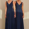 TO2493 Tania Olsen Bridesmaid Dress a V-cut neckline with 1-inch wide shoulders and a cross-over bust draping