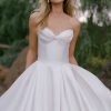 A softly pleated strapless, sweetheart neckline