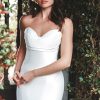fit and flare gown features a sculptural cowl effect